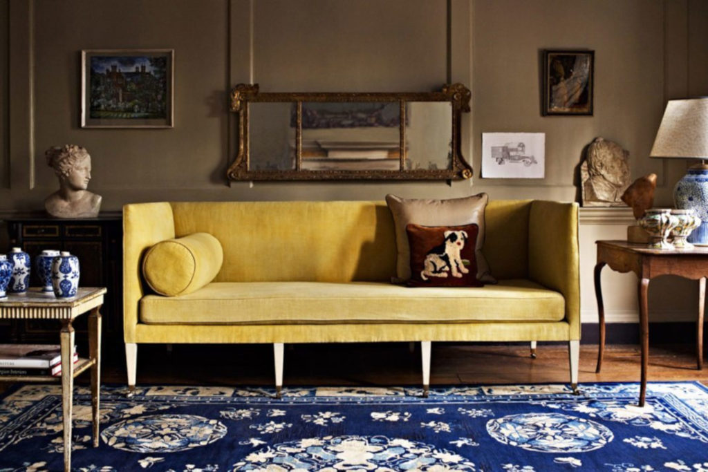 Gold sofa and blue rug