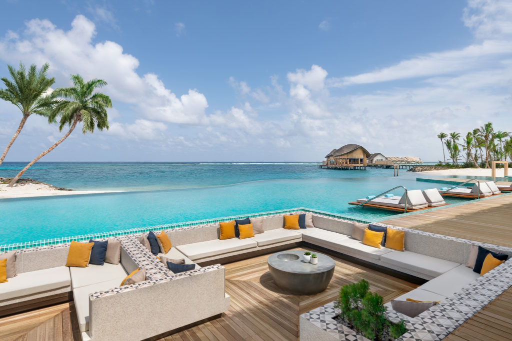 The main pool overlooking the sea at the Hilton Maldives Amingiri Resort & Spa