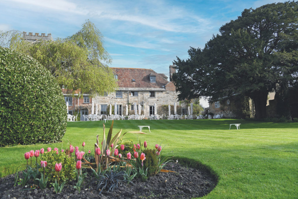 The Priory Hotel exterior view over green lawn